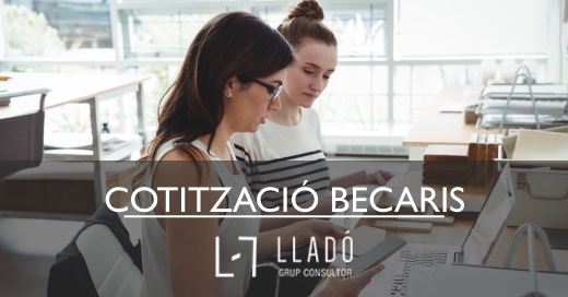 Business executives discussing over stone slab in office Cotització pels becaris Llado Grup